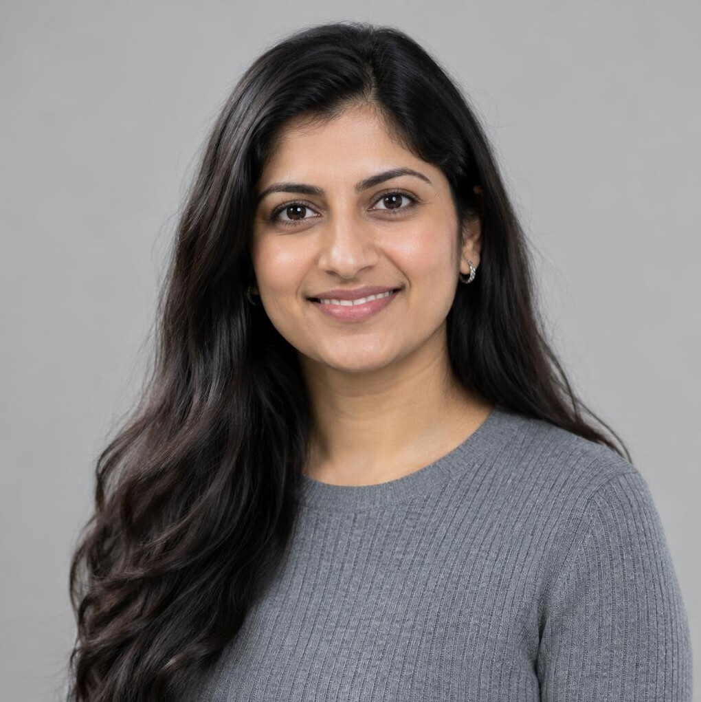 Portrait of a young woman with long dark hair smiling